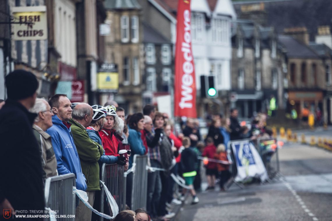 Spectators line the High Street, eager to watch the action
